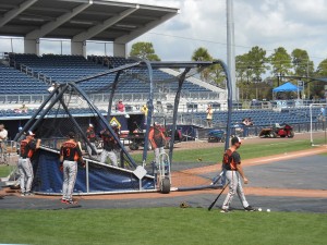 Members of the Baltimore Orioles warm up during a 2012 Spring Training game with the Tampa Bay Rays. Photo R. Anderson
