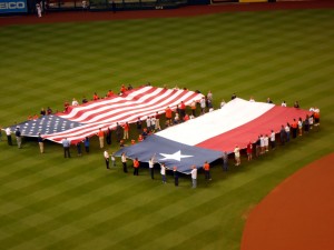 Opening nights in baseball such as the one last year between the Houston Astros and the Texas Rangers often feature large flags. Photo R. Anderson