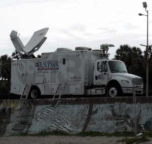 Like moths to the flame news vans like this one on the Seawall in Galveston become a familiar sight before and after the arrival of a hurricane. Photo R. Anderson